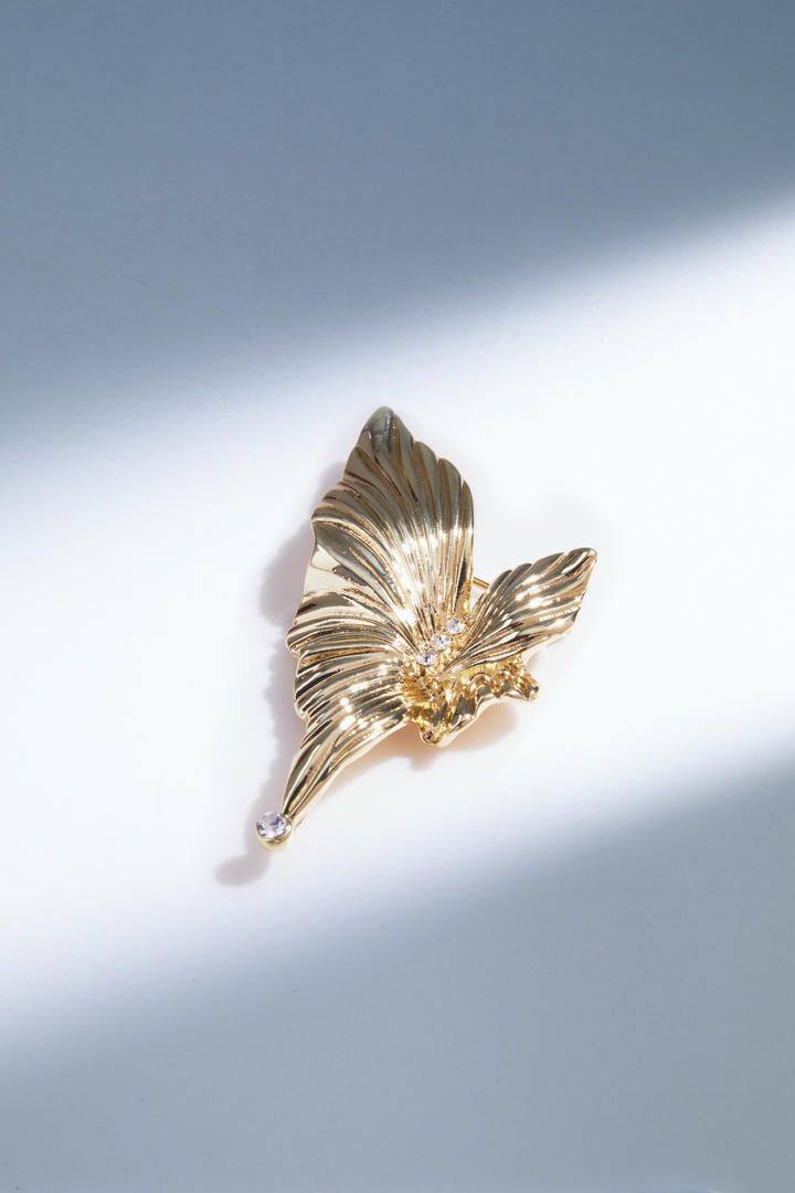 Golden flower brooch