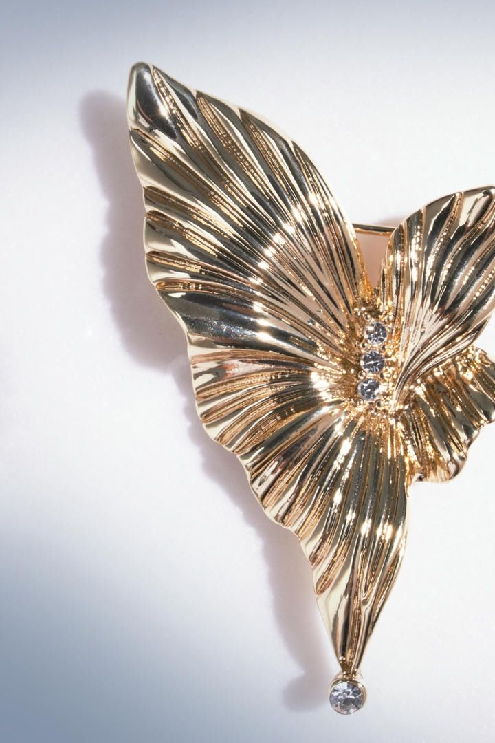 Golden flower brooch